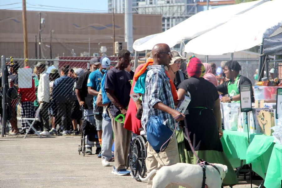 Neighbors lined up past the tables at Humanitarian Day.